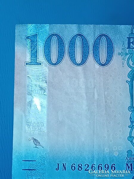 2023 évi 1000 Forintos, jelentős nyomdahibával.