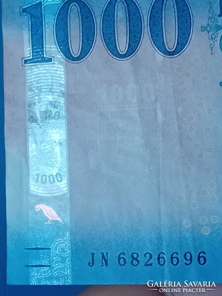 2023 évi 1000 Forintos, jelentős nyomdahibával.