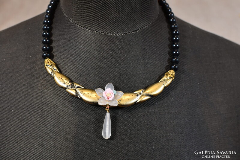Vintage costume jewelry necklace with black polymer beads and floral decoration