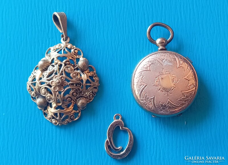 3 gold-plated pendants, one with a clasp