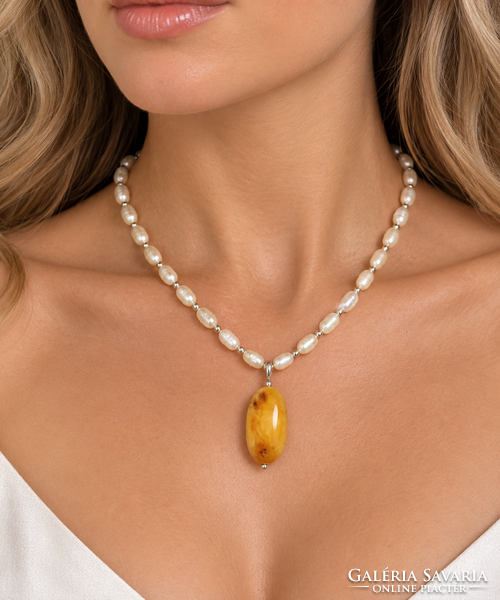 Pendant made of Baltic natural amber on a natural pearl chain